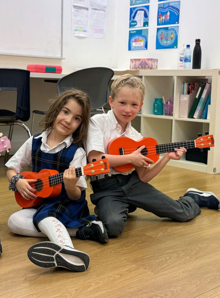 small class of K-7 students learning music instruments at Columbia Academy private elementary school Vancouver Yaletown