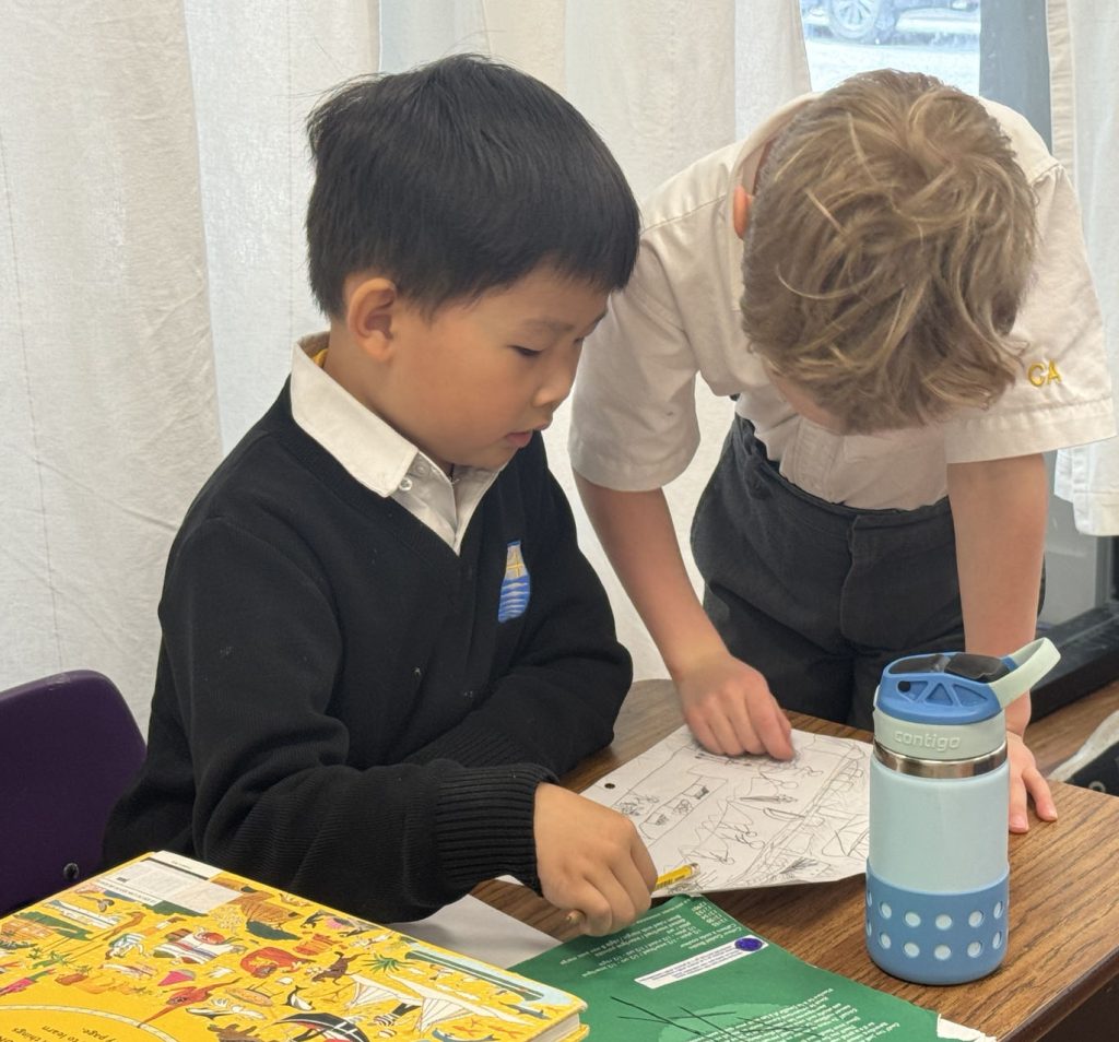 students participating in small group discussion classroom private elementary school Vancouver