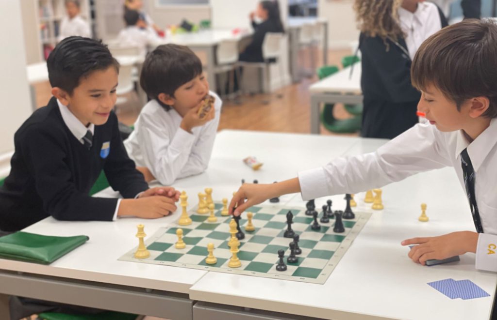 Columbia Academy Elementary School students playing chess at school