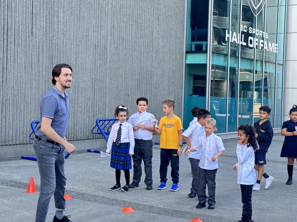 teacher guiding a small group during outdoor learning at an elementary school in Vancouver