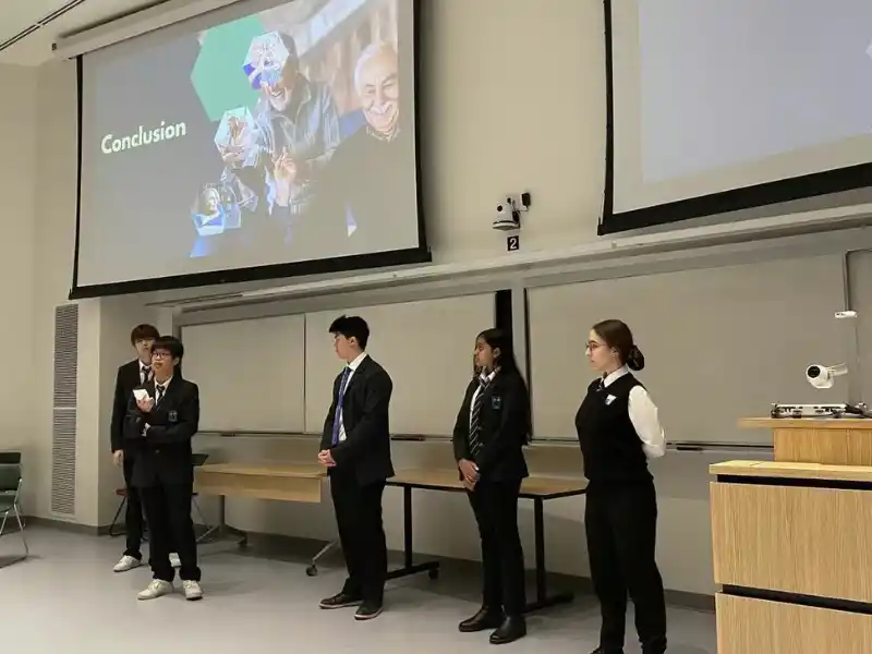 Columbia Academy high school students in Vancouver participating in an academic competition as part of their university preparation.